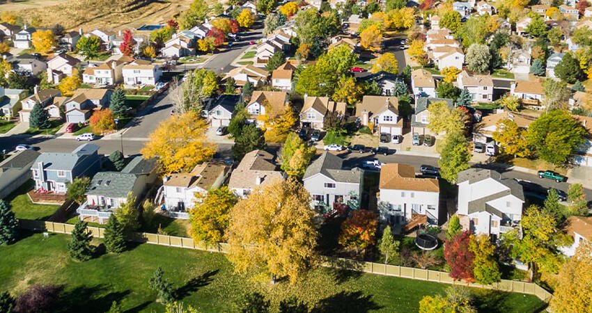 Aerial shot of a suburban neighborhood on a sunny day 