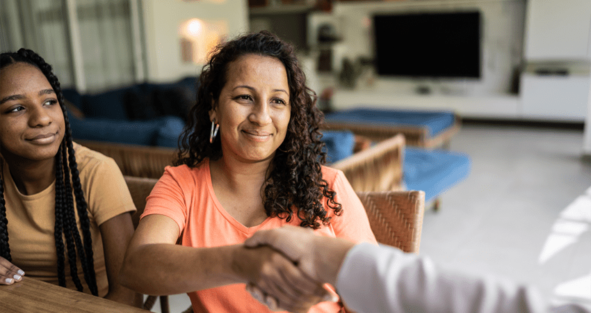 A woman reaches out her hand to shake hands