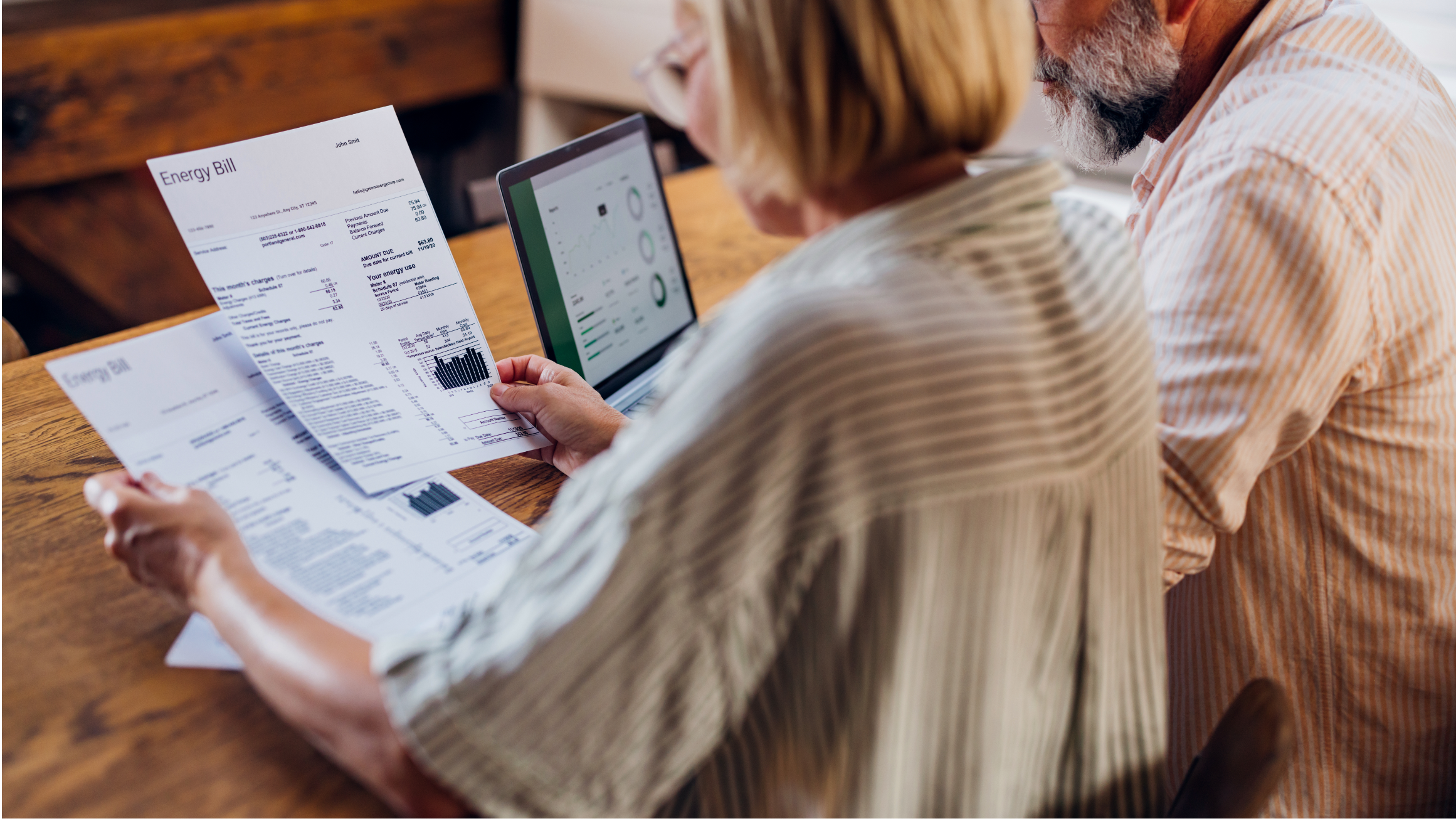 A couple looks at utility bills