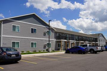 Photograph of a row of suburban houses and apartments