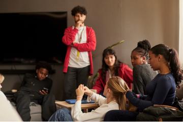 Young people gathered in a shared living space.