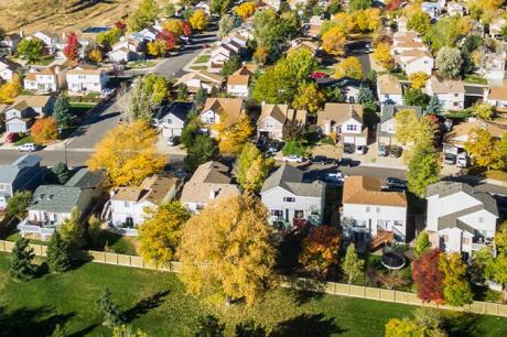 Aerial shot of a suburban neighborhood on a sunny day 