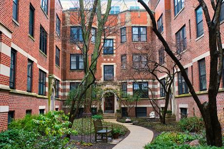 Image of a brick city apartment building with a courtyard