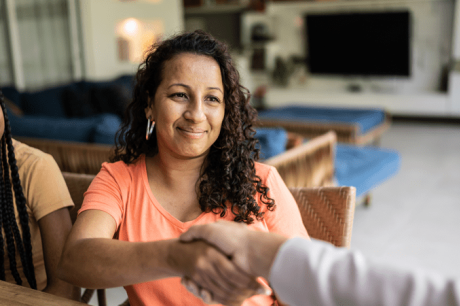 A woman reaches out her hand to shake hands